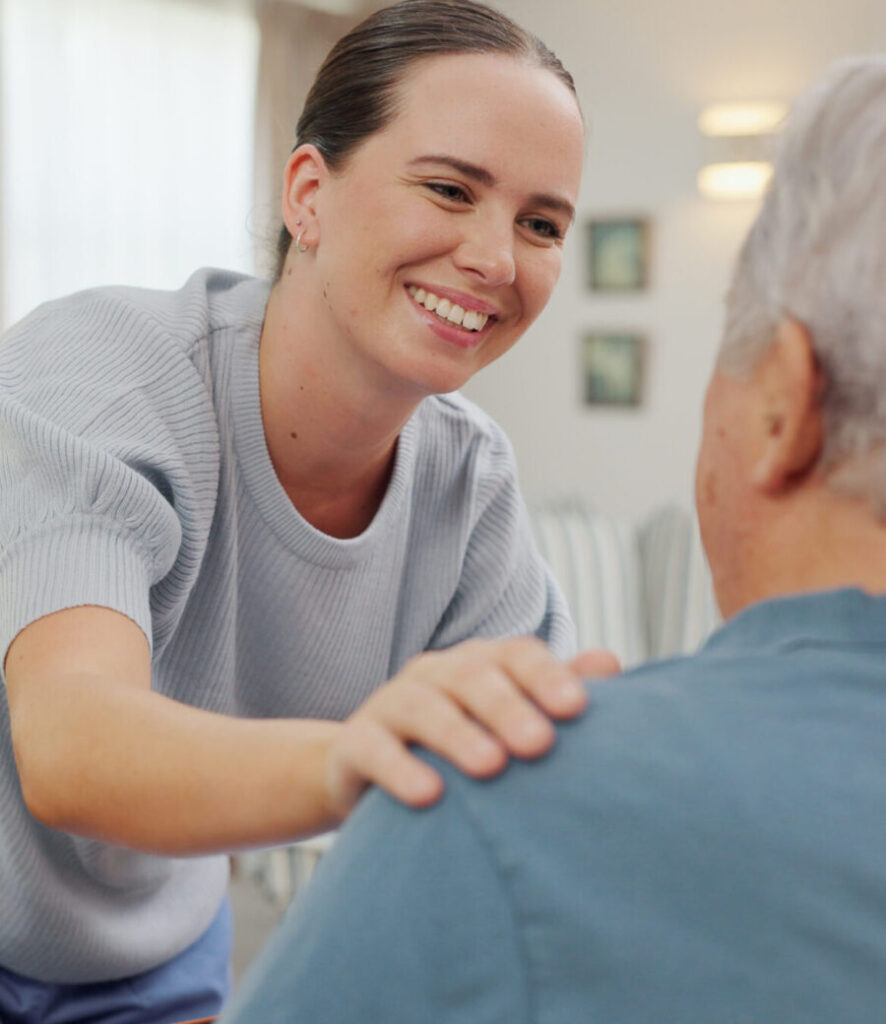 A Serenity Care carer supporting an elderly client at home