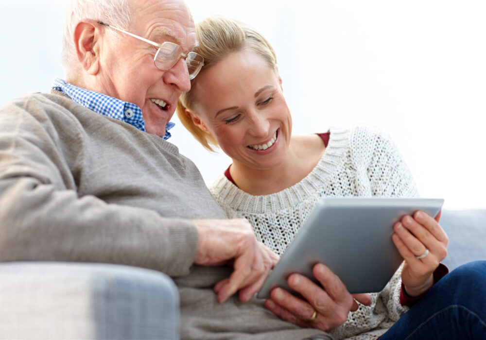 A client and family member reviewing a care plan together at home