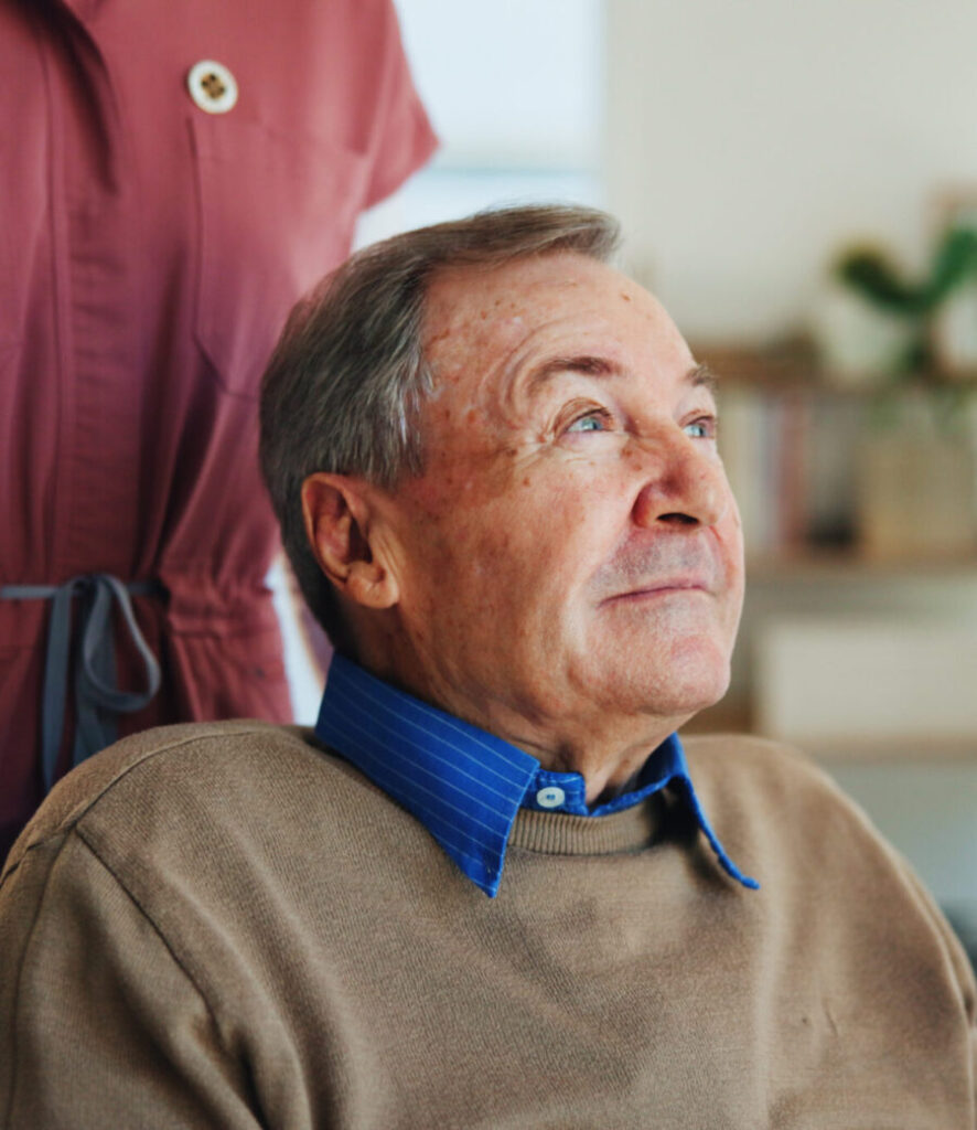 A Serenity Care carer supporting an elderly client at home